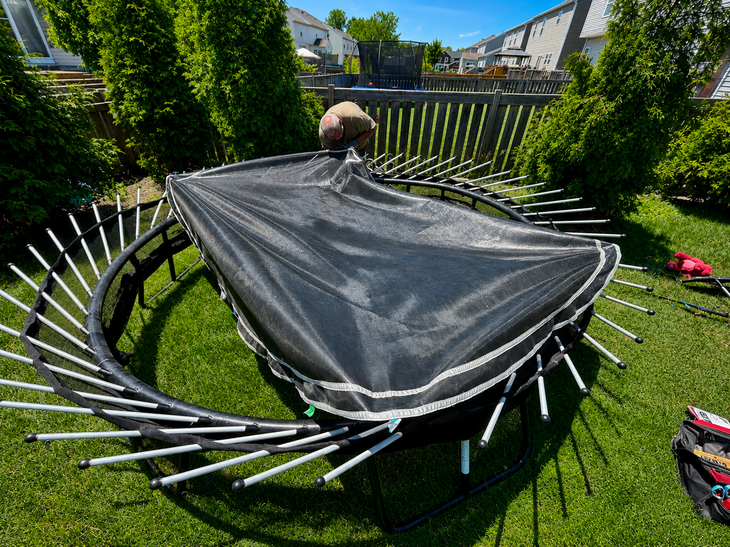Trampoline assembly and safety net installation